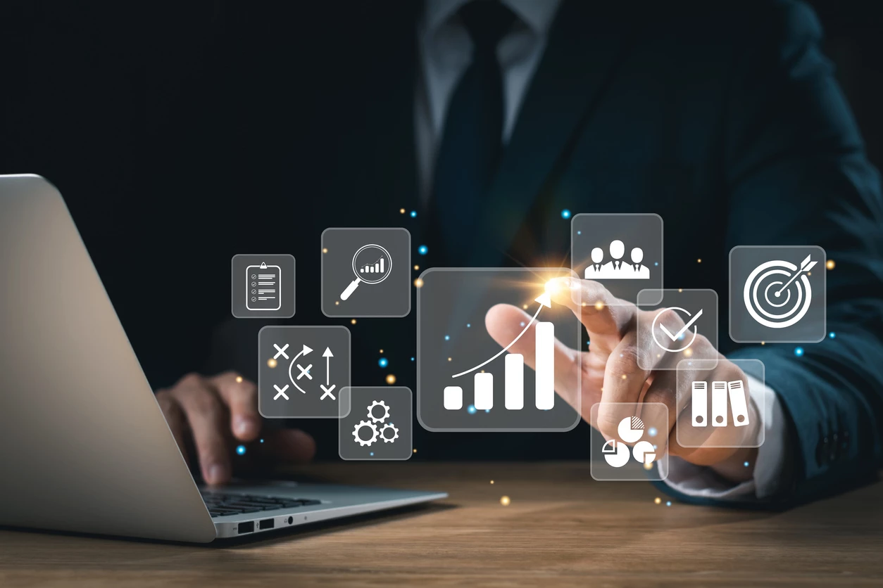 concept-of-long-term-business-development-and-management-executives-looking-at-virtual-screens-business-graph-icon-goal-setting-problem-solving-workflows-optimal-business-operations-and-innovation-1453749005-1258x838